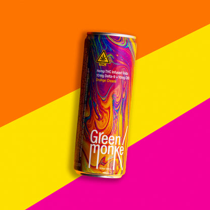 Green Monké Orange Cream THC soda can on a bold colorblock background