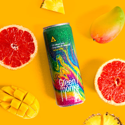 Green Monké Tropical Citrus THC soda can with fresh pineapple, grapefruit and orange